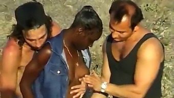 Interracial Threesome With An African Babe At The Beach